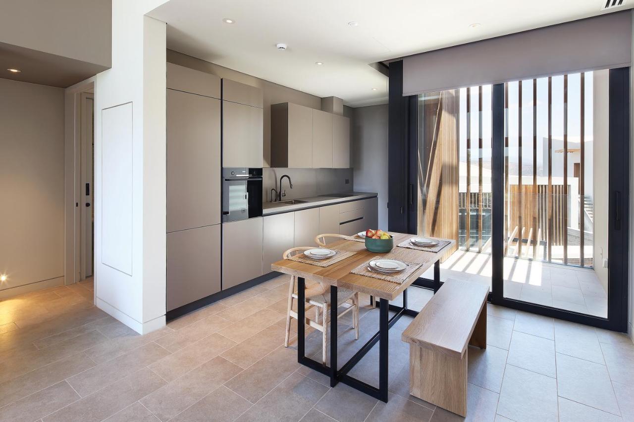Minthis Resort Tsadha Exteriör bild The kitchen and dining area of a typical apartment