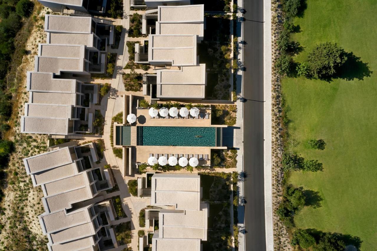 Minthis Resort Tsadha Exteriör bild Aerial view of the hotel