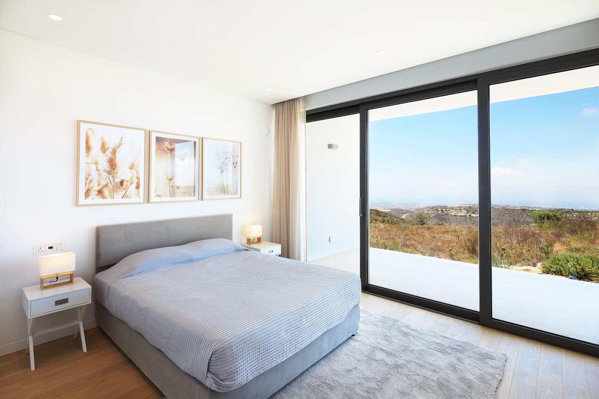 Minthis Resort Tsadha Exteriör bild Bedroom with sliding doors